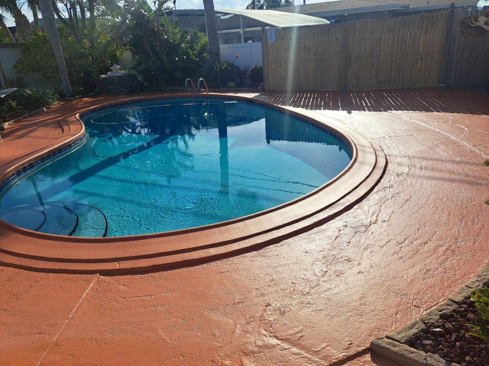 Enhance your home's durability and aesthetics with our Concrete Coatings service, offering long-lasting protection and a stylish finish for driveways, patios, pool decks, and garage floors tailored to your unique needs. for Red Knight Painting in Daytona Beach, FL