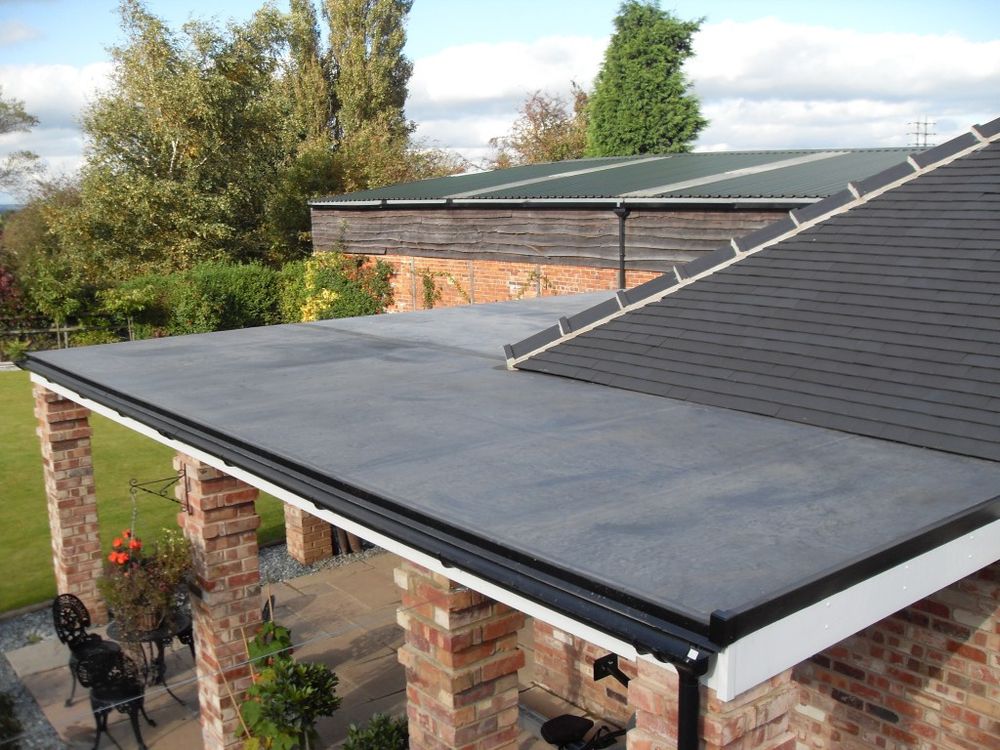 Our Flat Roof Gutters service ensures optimal water drainage with the best gutter guards, protecting your home from damage while enhancing durability and longevity. Trust us for seamless installation and maintenance. for Jays Roofing and Construction in Toledo, Ohio