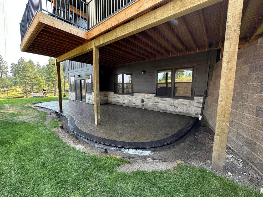 Our Patio Design & Construction service offers homeowners professional expertise in creating functional and visually appealing outdoor living spaces for relaxing, dining, and entertaining purposes. for Diamond Landscape & Hardscape LLC in Kalispell, MT