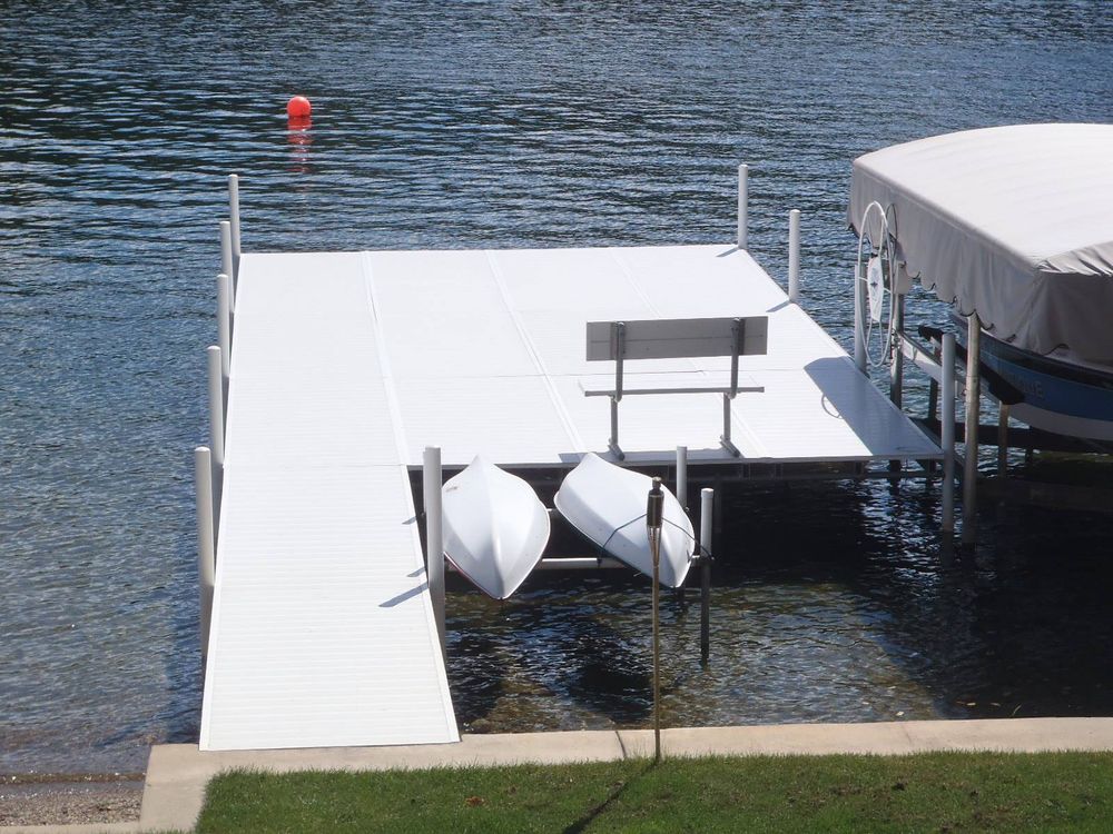 Transform your waterfront property with our Custom Docks service, offering personalized design and sturdy construction to enhance aesthetics and functionality for a perfect blend with your outdoor living space. for Tri-State Docks in  Angola,  IN