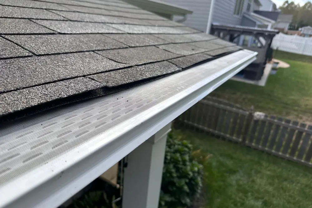 Our Gutter Guard Installation service includes expertly installing durable guards on your gutters to protect against debris buildup, ensuring efficient water flow and prolonging the lifespan of your roofing installation. for EJ Roofing in Sparta, North Carolina