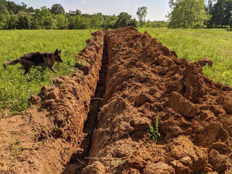 Our Sewer & Water Lines service ensures efficient installation, repair, and maintenance of underground pipes to provide you with reliable access to clean water and proper sewage disposal solutions for your home. for Kidd Excavating LLC in West Liberty, KY