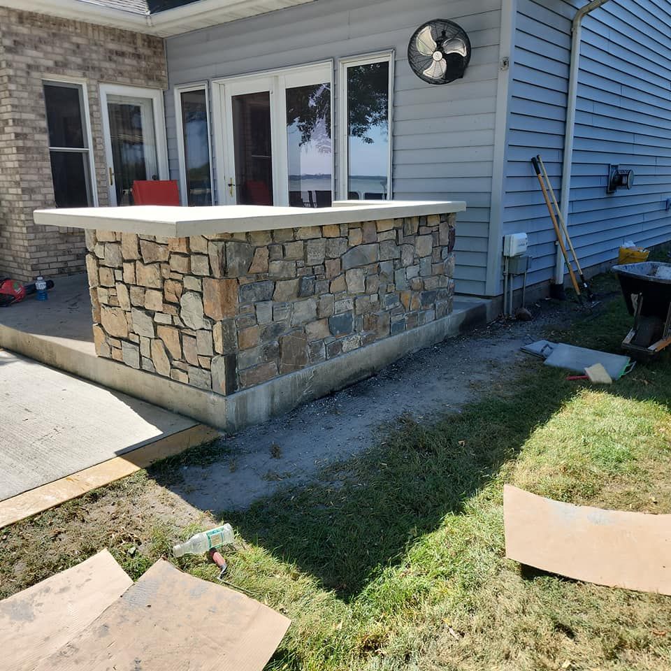 Transform your outdoor space with our expert patio design and installation services. We create durable, stylish concrete patios that enhance your home’s beauty while providing a perfect setting for relaxation and entertainment. for Cousins Construction in Murdock, MN