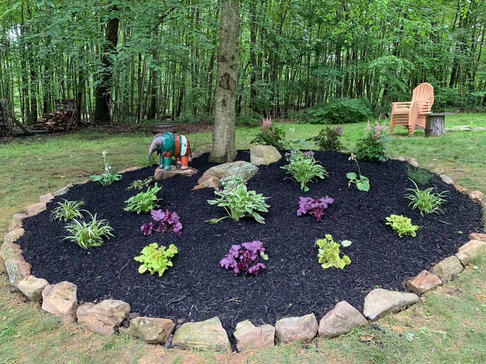 Enhance your outdoor space with our expert landscaping installation services, including precise mulch installation, to ensure vibrant gardens that boost curb appeal and promote healthy plant growth. for NK Landscaping LLC in Dutchess County, NY