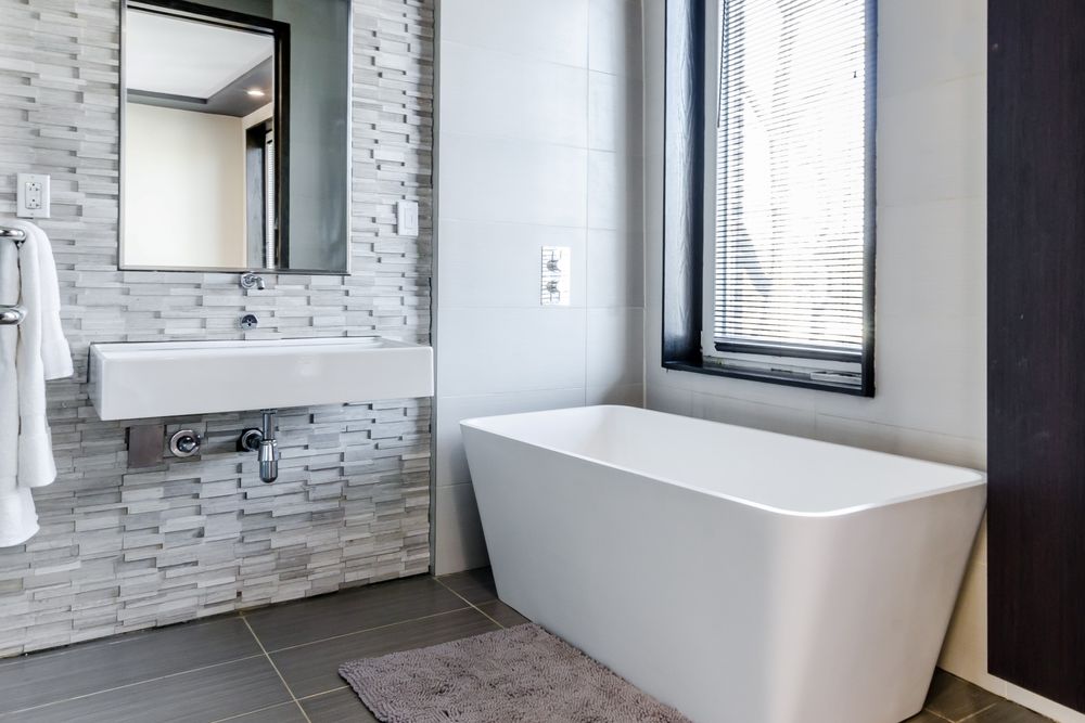 Our Bathroom Renovation service offers homeowners a complete transformation of their bathroom space, including new fixtures, tiles, and vanity installation for a stylish and functional result. for Full Spectrum Remodeling in Wilbraham, MA