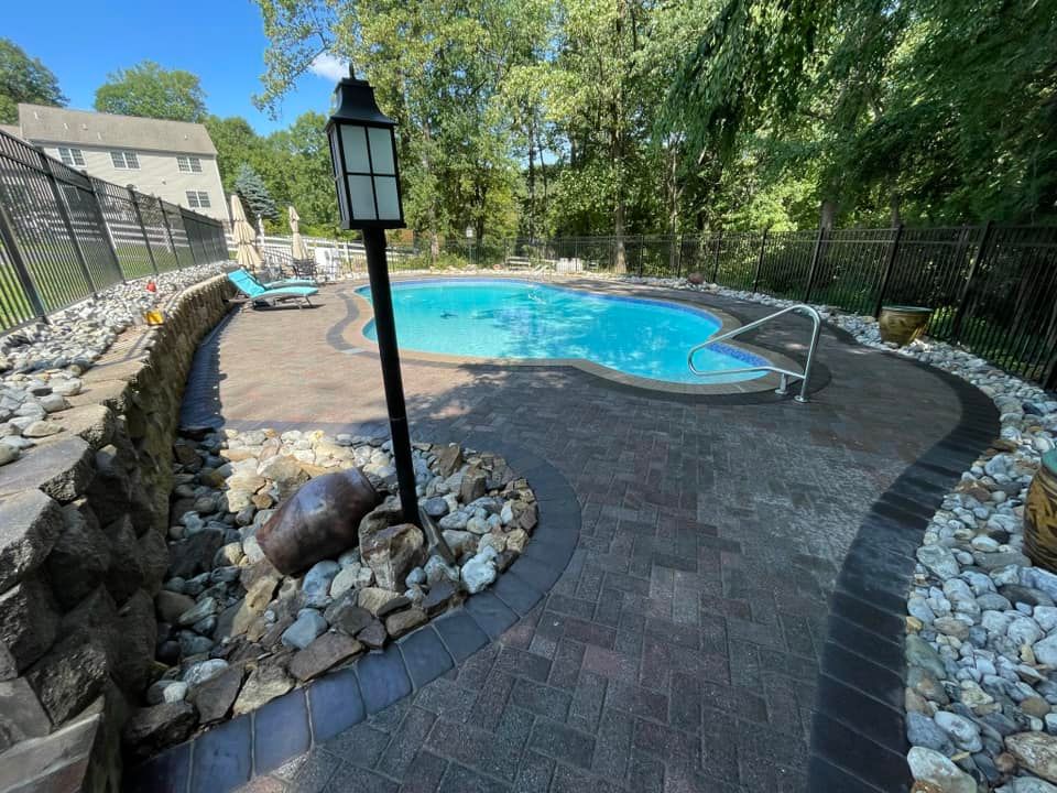 Transform your outdoor space with our expert Patio Design & Construction services. We create stylish, durable patios tailored to enhance functionality and beauty, perfect for relaxation or entertaining guests. for DNA Landscapes in Hackettstown, NJ