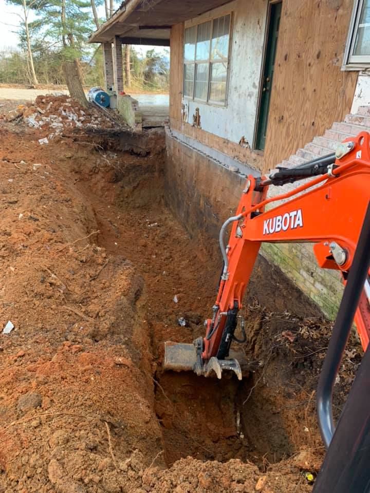 Our Foundation Digging service ensures precise, efficient excavation tailored to your home's structural needs, providing a solid base for construction while prioritizing safety and minimizing disruption to your property. for Wirt Construction in Greeneville, TN