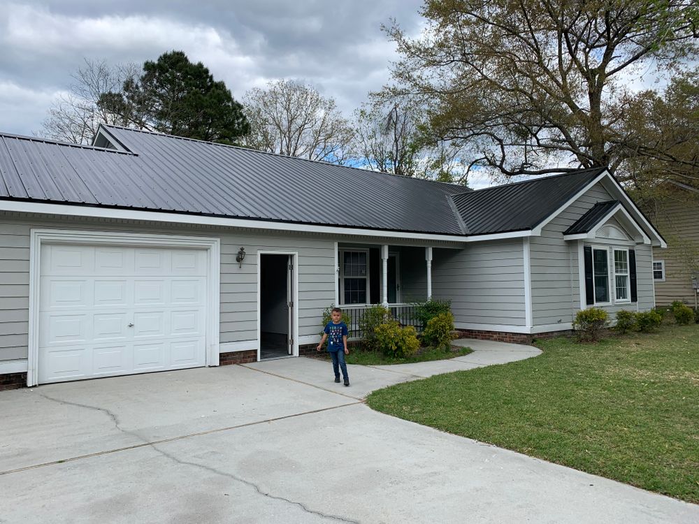 Our residential metal roofing master ribs service offers durable and stylish metal roofs for homeowners seeking long-lasting protection and an attractive appearance for their homes. for Safe Roofing Inc in Jacksonville, NC