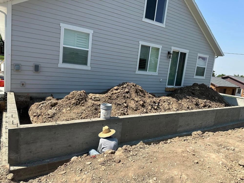 Our retaining wall construction service offers expertly designed and durable solutions to enhance your landscape, prevent soil erosion, and improve the aesthetics of your outdoor space with high-quality concrete craftsmanship. for Pro-Superior Concrete Construction LLC in Salt Lake City, UT