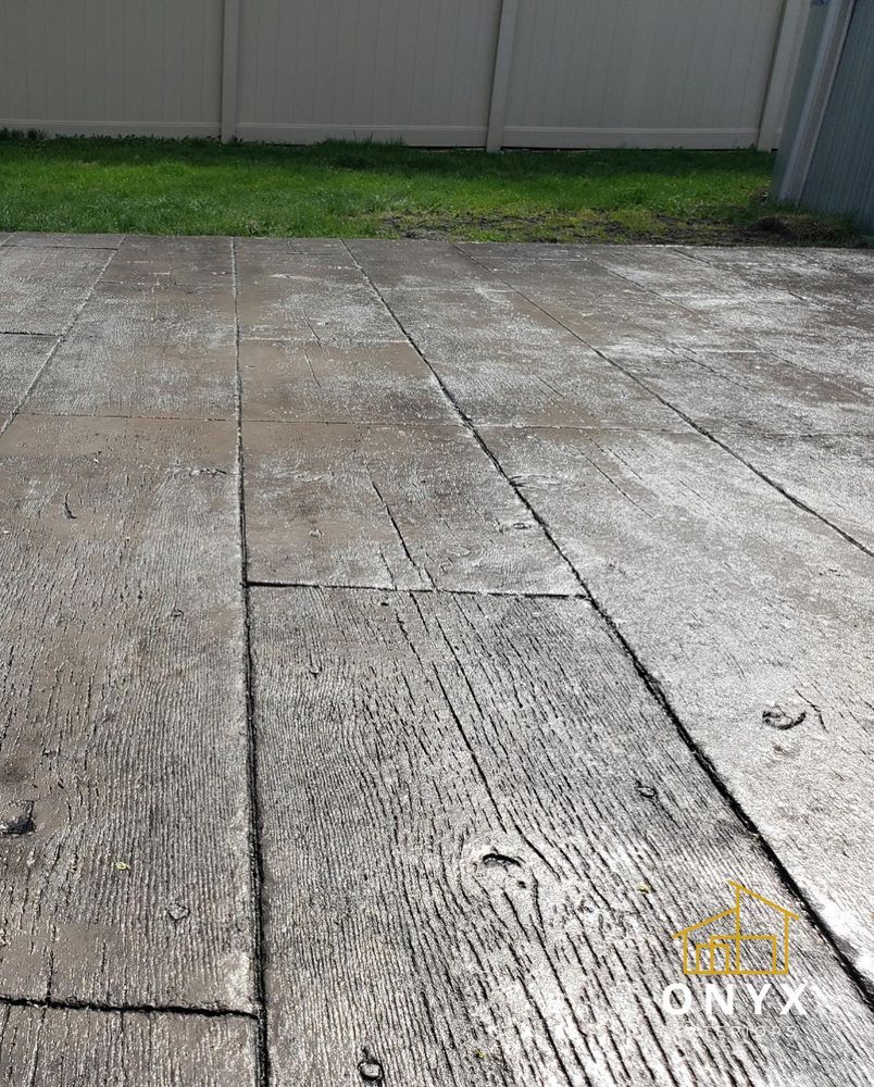 Enhance your home with our expert stamped concrete installation service. Transform plain concrete into stunning designs, textures, and patterns to elevate the aesthetic appeal of your outdoor spaces seamlessly. for Onyx Concrete Contractors in Chicago, IL