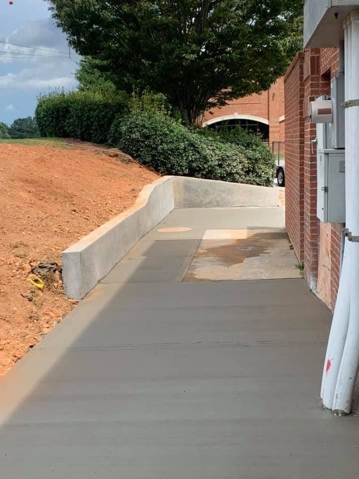 Our Concrete Slab Construction service offers homeowners a durable and reliable solution for creating sturdy foundations or flooring with precision and expertise. for Compadres Concrete in Griffin, GA