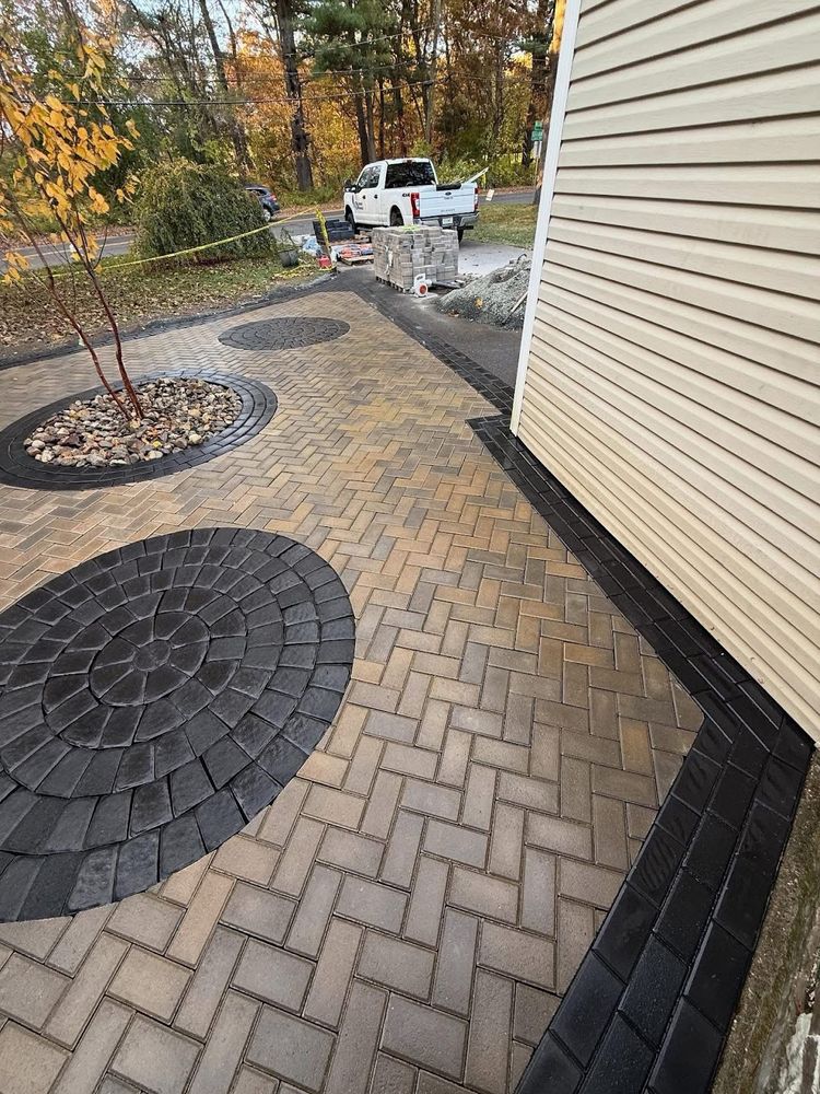 Our Brickwork service expertly combines durability and aesthetics, offering homeowners beautifully crafted walls, patios, and fireplaces that enhance property value while ensuring long-lasting strength and minimal maintenance for peace of mind. for Elite Pavers and Fencing in Springfield, MA