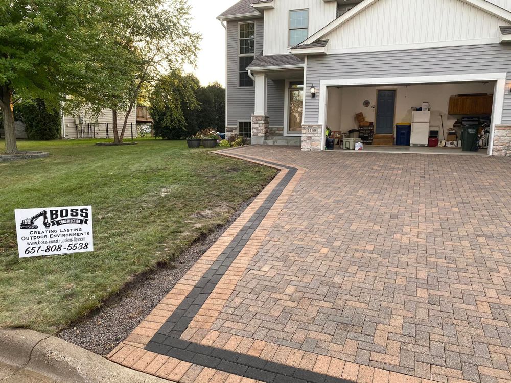 Our Pavers service offers a unique and affordable way to add style and functionality to your home's landscape. Whether you're looking to create a new patio, walkway, or driveway, our experienced professionals will work with you to design and install a custom paver solution. for Boss Construction in Saint Paul, MN