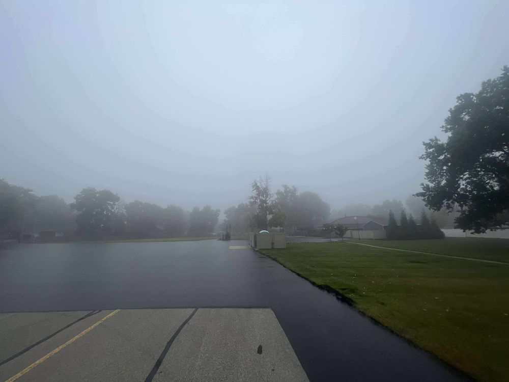 Enhance your home's curb appeal with our expert roadway paving service, offering durable asphalt solutions that ensure smooth, long-lasting surfaces for driveways and paths tailored to withstand weather conditions. for Hundley Sealcoating LLC in Hamilton, OH