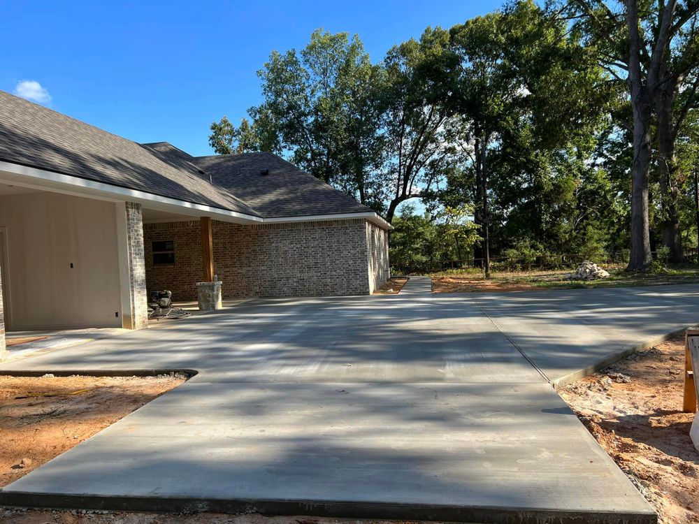 Enhance your home's curb appeal and functionality with our professional Sidewalk Installation service. Our experienced team will expertly install durable concrete sidewalks to enhance the overall beauty of your property. for Phillips Concrete Construction in Rice, TX