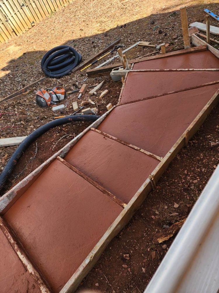 Discover what is concrete with our expert service, enhancing your home’s durability and beauty. Our team delivers precise installation for driveways, walkways, or patios tailored to your needs. for WCDI - We Can Do it Design & Build in Sharpsburg, GA
