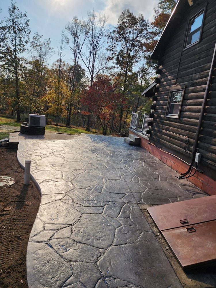 Our stamped concrete service creates durable, attractive surfaces that mimic stone, brick, or slate. We expertly prepare, pour, and finish patios, walkways, and driveways for lasting curb appeal. for Heckman Hauling & Excavating in Nescopeck, PA