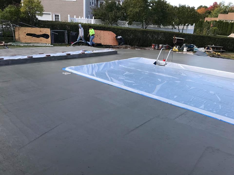 Our Flat Work service delivers expertly installed and durable concrete surfaces, like driveways, patios, and walkways, enhancing your home's curb appeal with customized designs tailored to your style and needs. for Stallion Concrete Inc in Berkley, MA