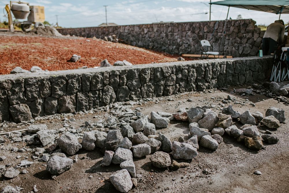 Our Rockwall Construction service specializes in expertly designing and building sturdy rockwalls to enhance the aesthetic appeal and structural integrity of your property, ensuring long-lasting durability and functionality. for Pita’s Masonry in Hilo, HI