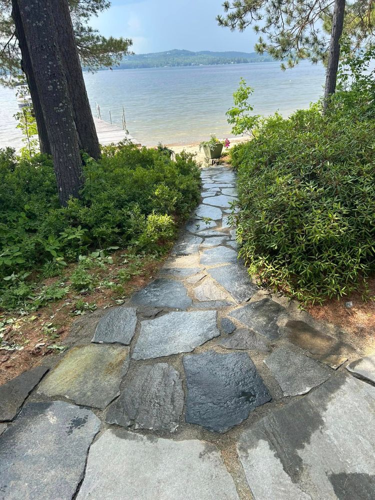 Enhance your home's outdoor appeal with our expert patio design & construction services, offering customized walkway solutions that seamlessly blend aesthetics and functionality for a welcoming and durable landscape. for Thomas Clifford Property Services LLC in Enfield, NH