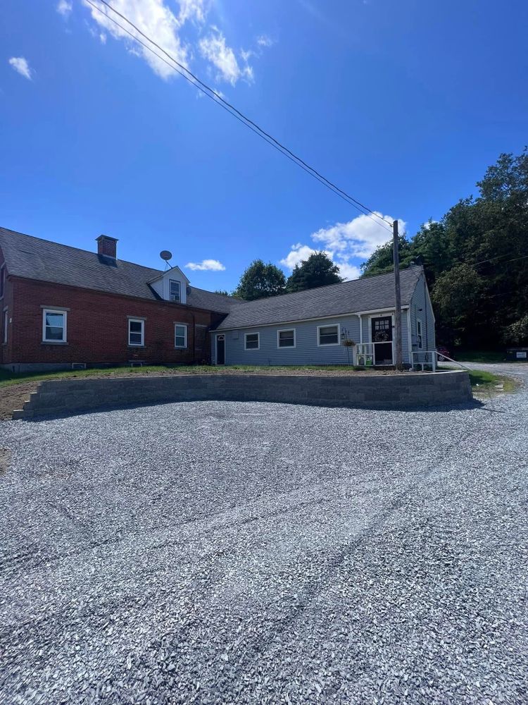 Our Retaining Wall Construction service provides durable and aesthetically pleasing solutions to prevent soil erosion, enhance landscape appeal, and ensure structural stability for your property with expert craftsmanship and quality materials. for Bradleyworx in Troy, NH