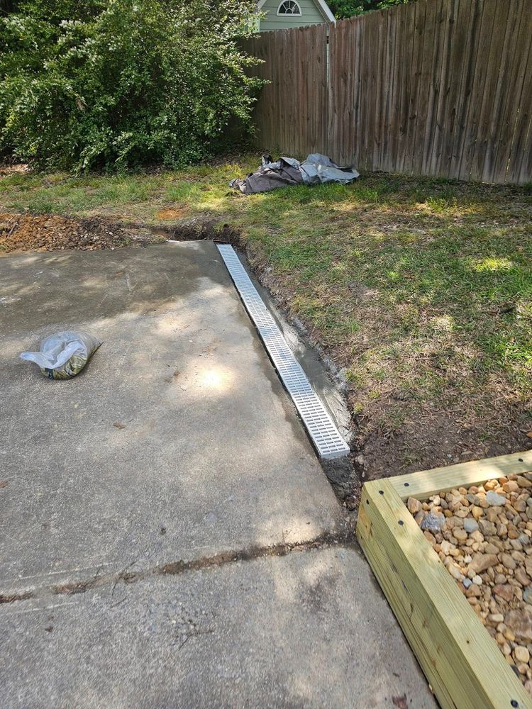 Our Drainage Solutions ensure your property stays beautiful and protected by expertly managing water flow, preventing erosion, and enhancing the longevity of your landscaping with tailored systems for optimal performance. for The Grand Design in Raleigh, NC