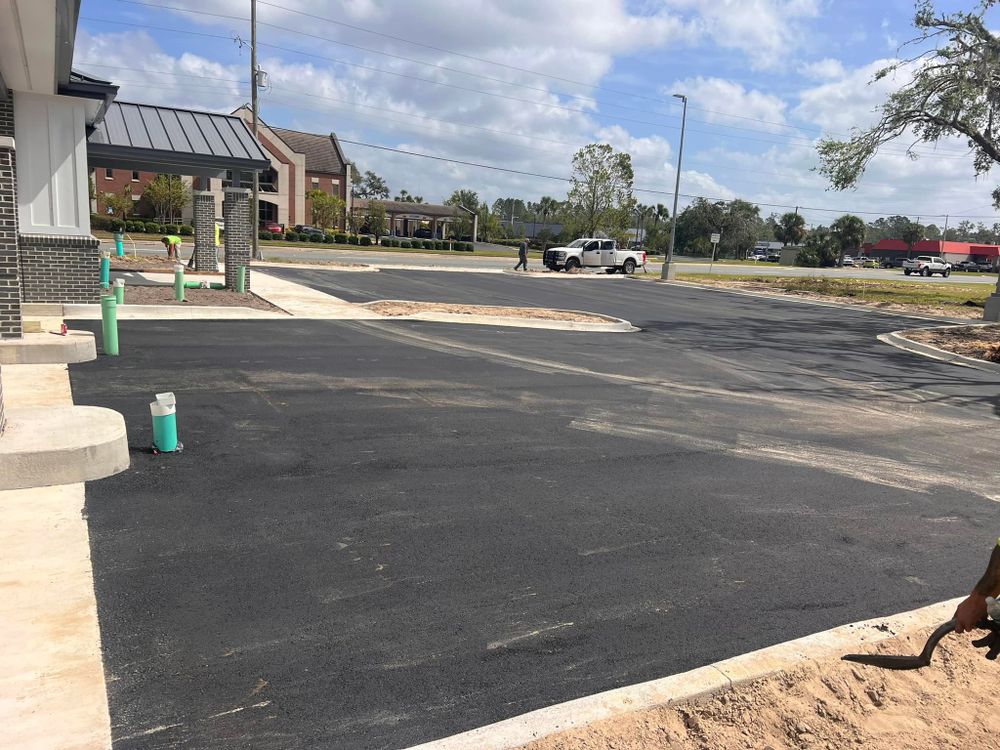 Enhance your home's curb appeal with our professional asphalt paving services. We deliver durable, smooth finishes ensuring long-lasting driveways and walkways tailored to fit your style and budget needs. for Asphalt Management Group in Macclenny, FL