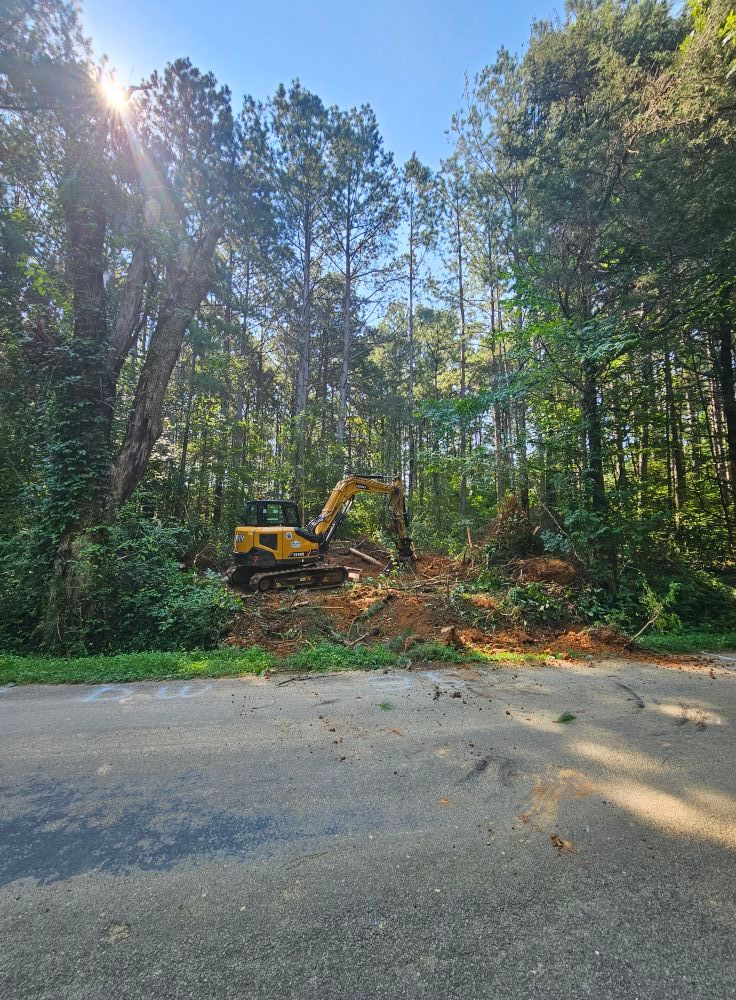 Our Land Clearing & Demolition service expertly removes unwanted structures and debris, preparing your site efficiently for new projects while ensuring safety and minimal environmental impact. Trust us for a clean, ready-to-build property. for Whaley Land Development in Athens, TN