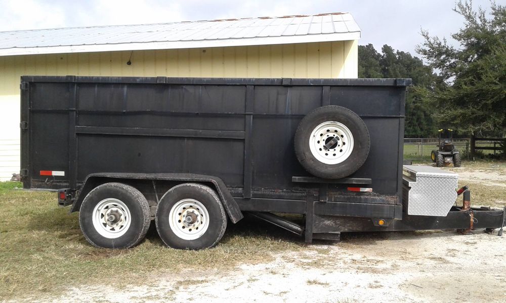 Our Debris Removal service efficiently clears away fallen branches and clutter following tree removal, ensuring your property remains clean and safe while enhancing its appearance with professional, reliable care. for Alpha Trees Service and Property Management in Port Charlotte, FL