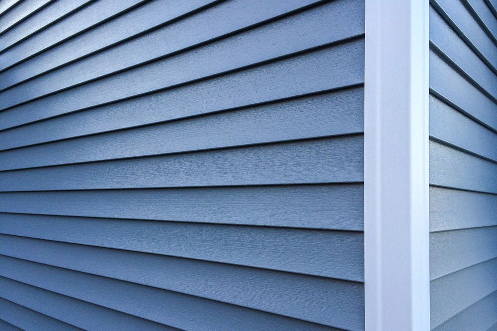 Enhance your home's exterior with our professional vinyl siding installation, complementing our expert roofing installation services for a durable and cohesive look, increasing curb appeal while providing energy efficiency and weather protection. for Lopez Roofing & Remodeling in Whiteville, NC