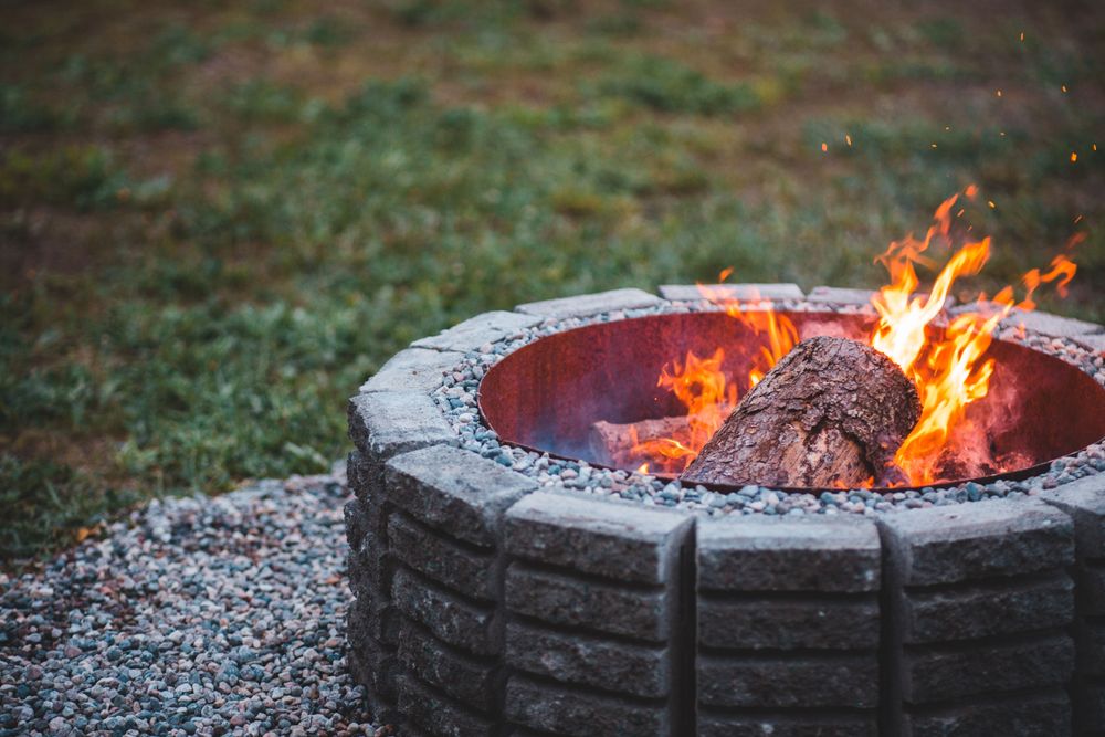 Enhance your backyard oasis with our custom fire pits, perfect for relaxing evenings. Expertly crafted to complement your pool area, we provide warmth and ambiance for memorable outdoor gatherings. for Montgomery Custom Pools in Montgomery, TX