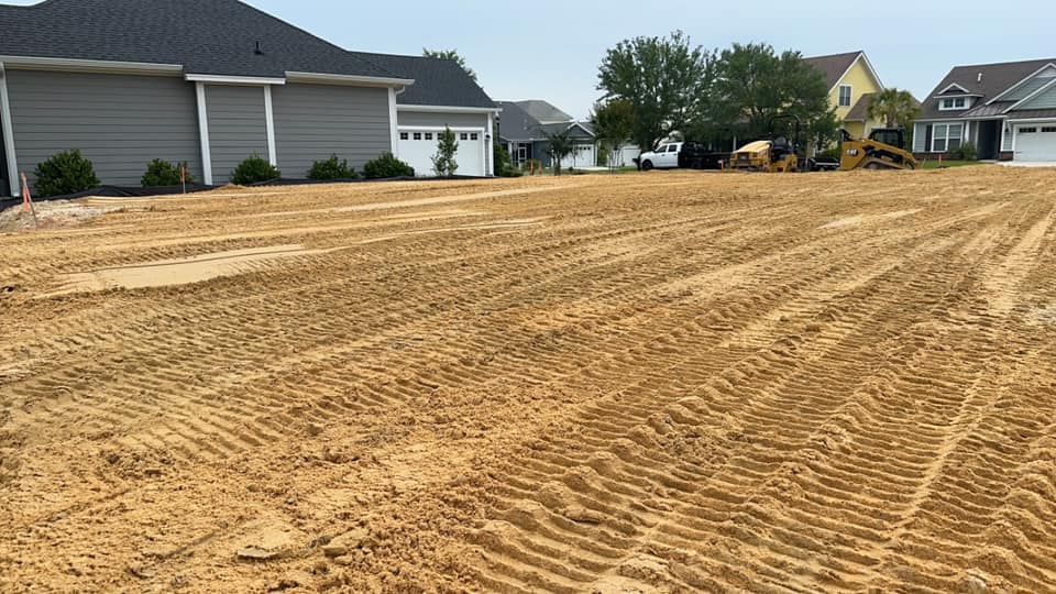 Our Site Grading service ensures your land is perfectly leveled and prepared for construction, enhancing safety and stability. Paired with expert land clearing, we create a solid foundation for any project. for Iron Industries in Bluffton, SC
