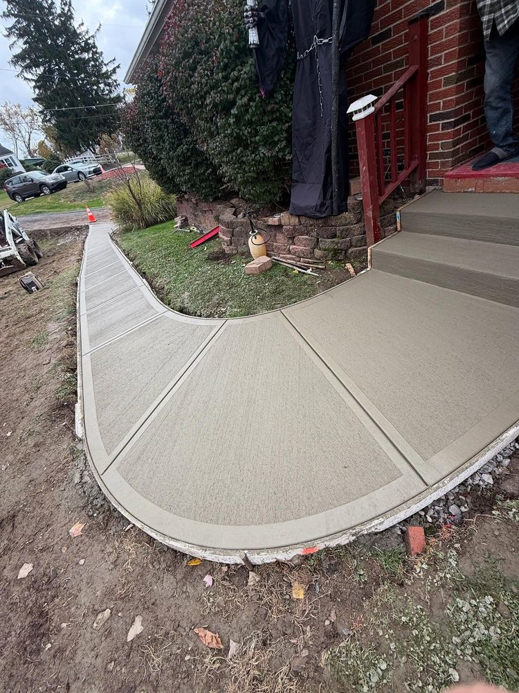 Enhance your home's outdoor space with our expert concrete installation service, offering durability and aesthetic appeal through customized solutions for driveways, patios, walkways, and more to complement your landscape vision. for Mark's Multiple Landscaping in Pittsburgh, PA