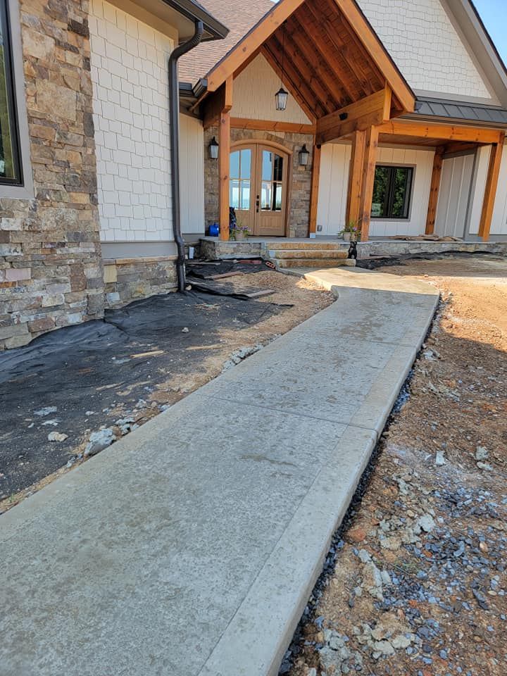 Enhance your home with our expert sidewalk installation service, providing durable, aesthetically pleasing concrete pathways designed to complement your exterior and ensure safety, longevity, and curb appeal for any property. for Gunter's Concrete in Newport, TN