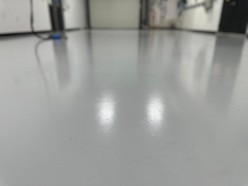 Transform your home's aesthetic with our epoxy floor coating service, providing a durable and easy-to-maintain surface that complements any decor while seamlessly matching the elegance of wood flooring. for Fantastic Epoxy Floors in Spring, TX