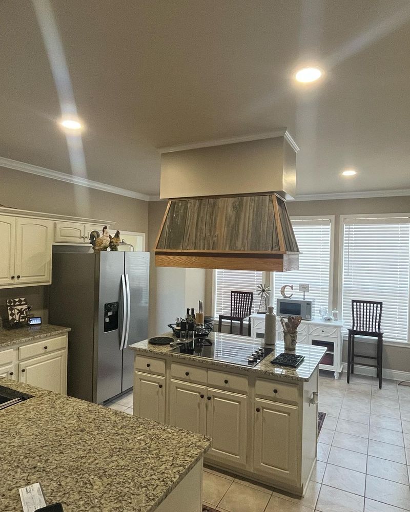 Our Kitchen and Cabinet Refinishing service offers homeowners a cost-effective way to revitalize their kitchen space by refreshing the appearance of cabinets with a professional paint job. for Spell Painting LLC in Lafayette, LA