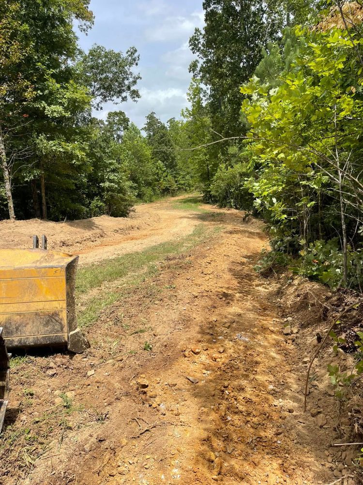 Our Roadbeds service ensures durable and stable foundations for driveways and private roads, using expert techniques to prepare your landscape effectively for paving, enhancing longevity and performance while prioritizing safety. for Maness Trucking & Excavation in Lexington, TN