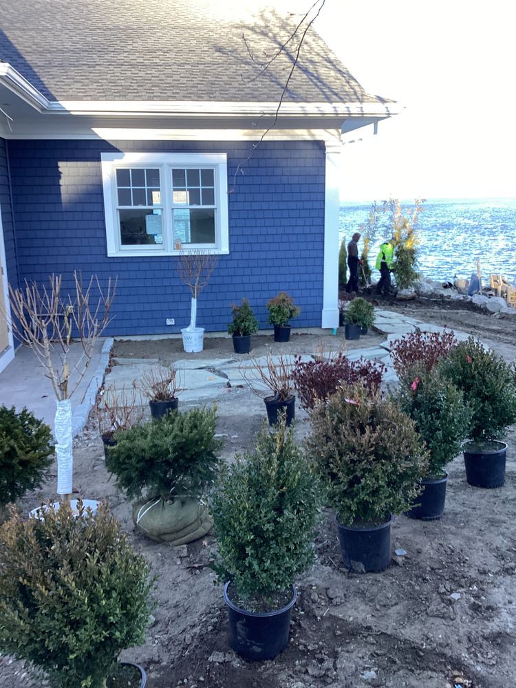 Our expert landscape designers work closely with homeowners to create beautiful and functional outdoor spaces, using a variety of materials including concrete for paths, patios, and retaining walls. for M.J. Construction & Landscape INC in Bristol, RI