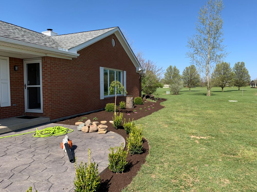 Our Planting and Seeding service includes expertly planting flowers, trees, grass seed, and more to transform your outdoor space with lush greenery. Let us help you create a beautiful garden oasis! for Higgins landscaping LLC in West Jefferson, OH