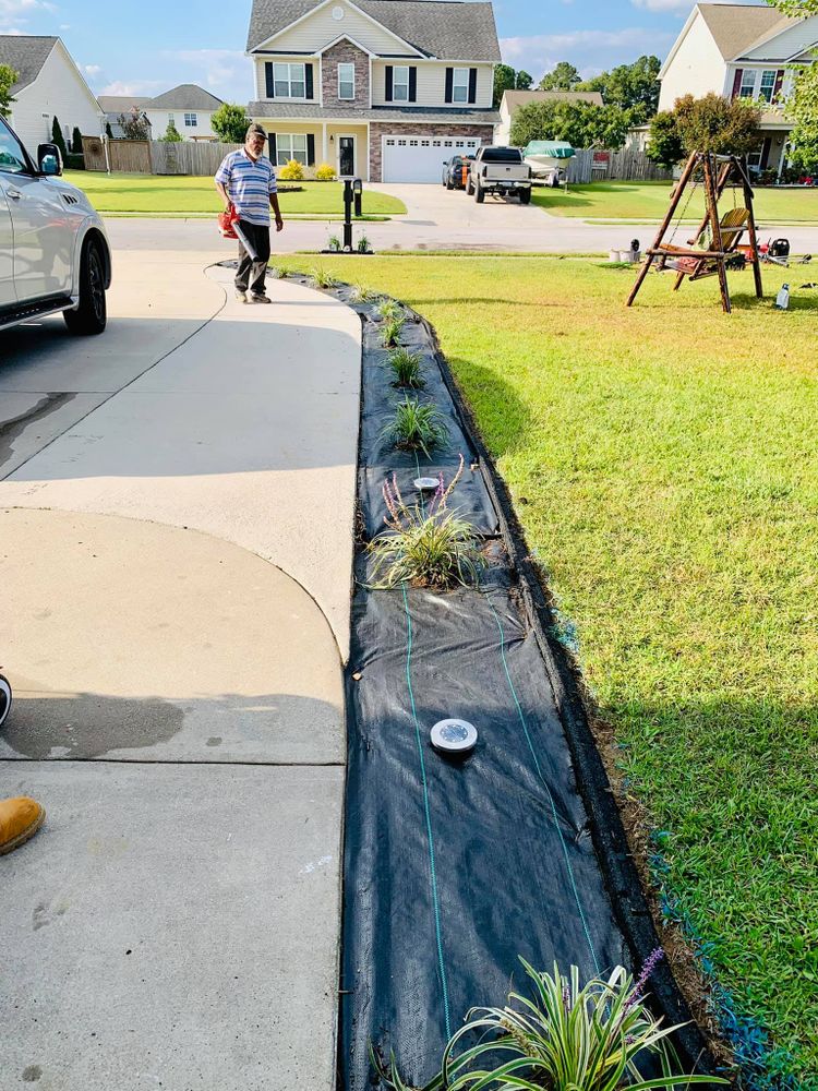 Mowing for All in One Landscaping in Jacksonville, NC