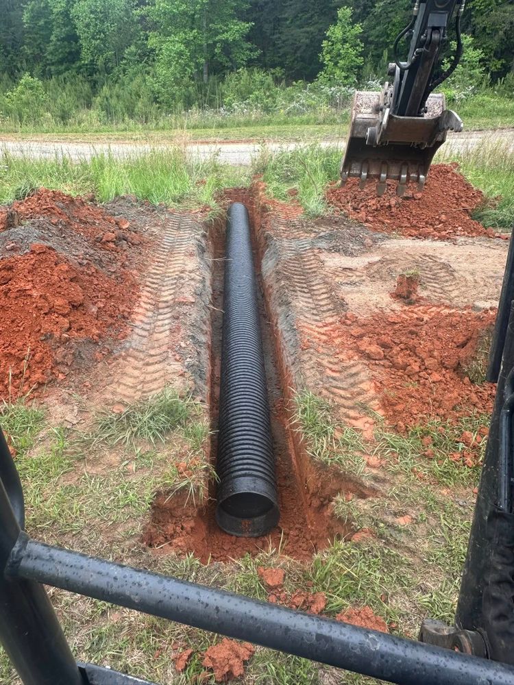 Our expert culvert pipe service ensures efficient water management, preventing property damage. We install durable pipes with precision to protect your landscape and ensure long-lasting functionality for peace of mind. for CSM Hauling in Rutherfordton, NC