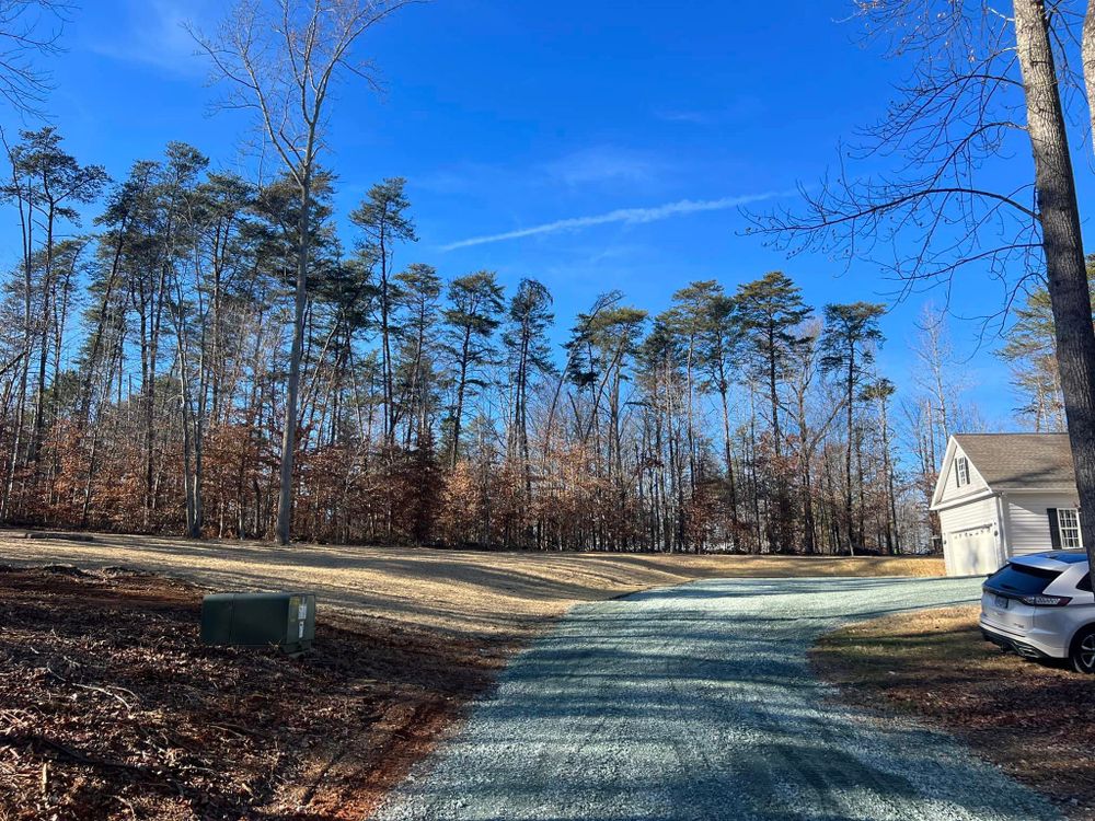 Our driveway maintenance service ensures long-lasting surfaces, minimizing repairs and reducing future driveway cost, providing homeowners with durable solutions that enhance curb appeal and protect their investment. for Cedar Point Land Management in Richmond, VA