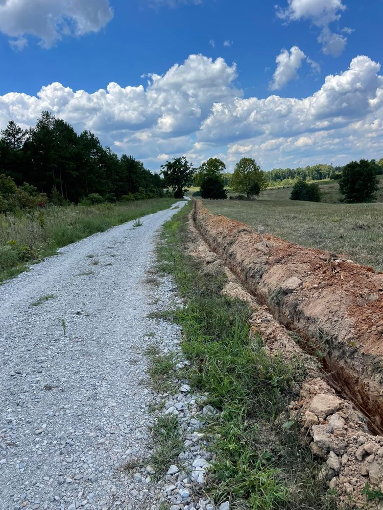 Our trenching service offers precise and efficient digging for utility installations, drainage systems, and landscaping needs. Trust our experienced team to enhance your property's functionality while ensuring safety and minimal disruption. for Double V Services in Dickson, TN