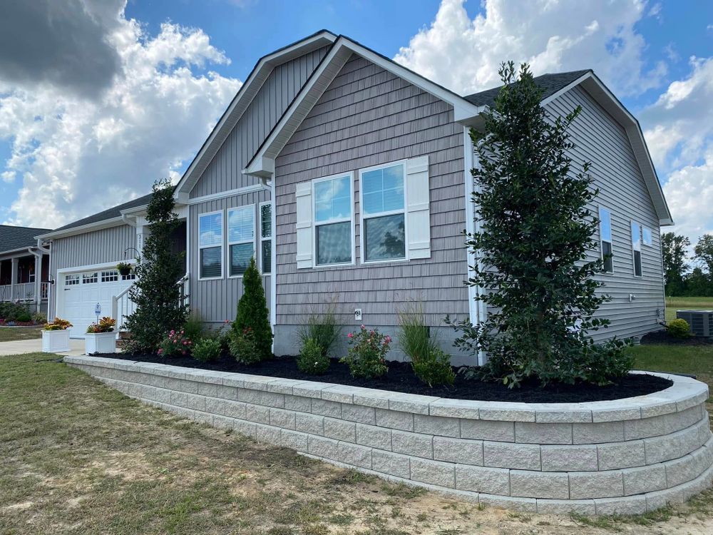 Enhance your outdoor space with our expert retaining wall installation, providing durability and style. While you're here, consider adding festive touch with our "Christmas lights installation near me" service for a magical holiday season. for Superior Lawn Solution in Coats, NC