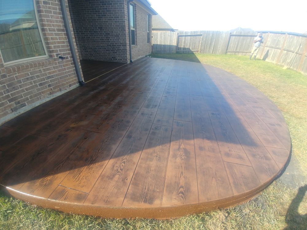 Enhance your home's curb appeal with our overlay stamped concrete installation. Transform existing surfaces into elegant, durable designs, mimicking the beauty of natural stone at a fraction of the cost. for Terracraft Concrete Design in Houston, TX