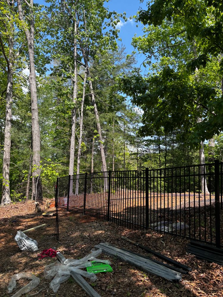 Enhance your home's security and aesthetics with our durable aluminum fences. We also offer comprehensive fence repair services to ensure your investment remains strong and visually appealing for years to come. for Alpine Fence in Dahlonega, GA