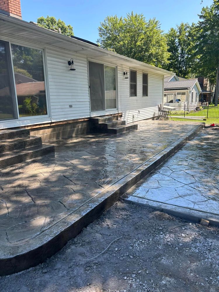 Enhance your outdoor living space with our expert concrete patio services. We design and install durable, stylish patios that perfectly complement your new construction home, ensuring quality craftsmanship and lasting beauty. for Crown Construction in Armada, MI