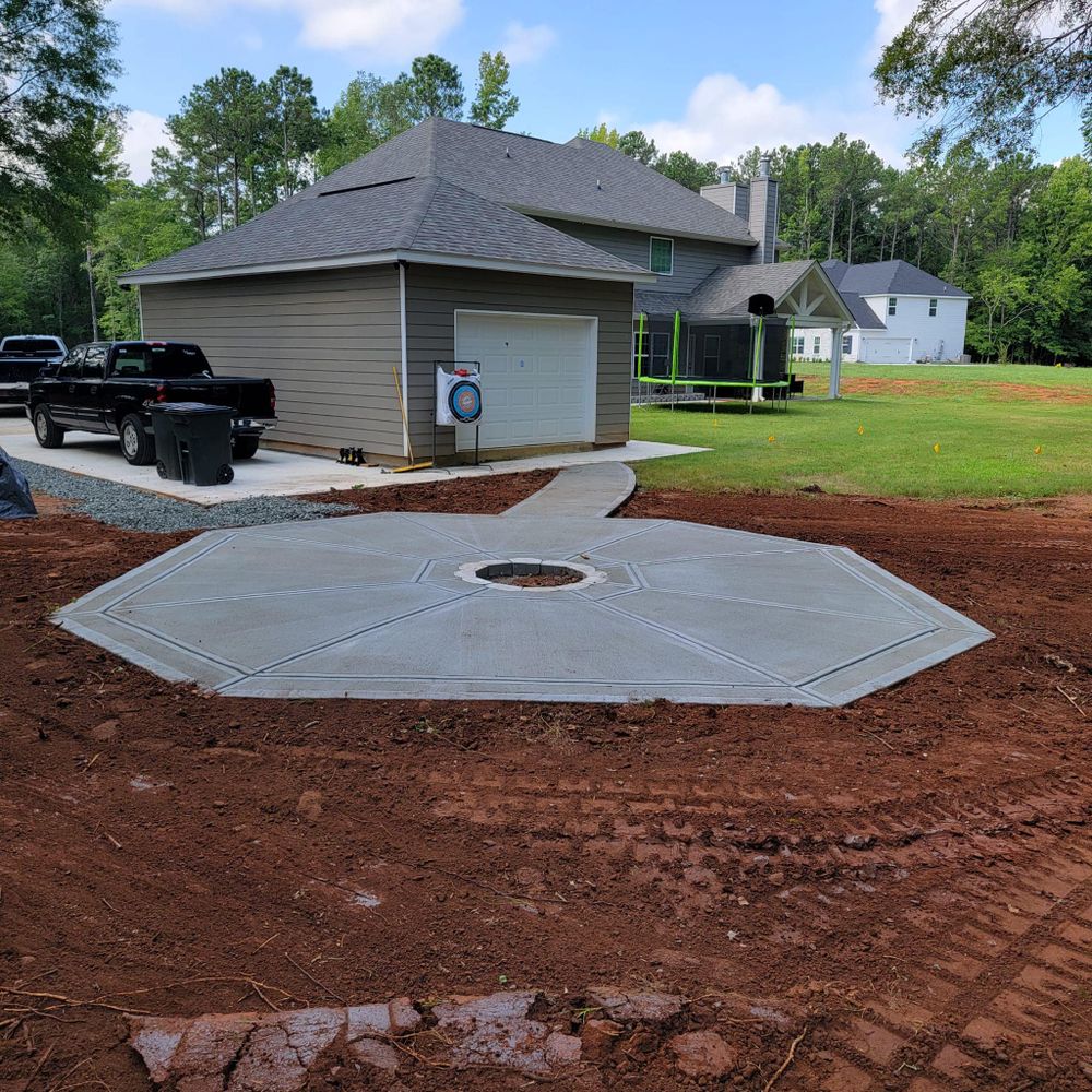 Transform your outdoor space with our expert patio design and installation service. We combine durable materials, innovative designs, and skilled craftsmanship to create the perfect concrete patio for your home. for Cortes Concrete LLC in Athens, GA