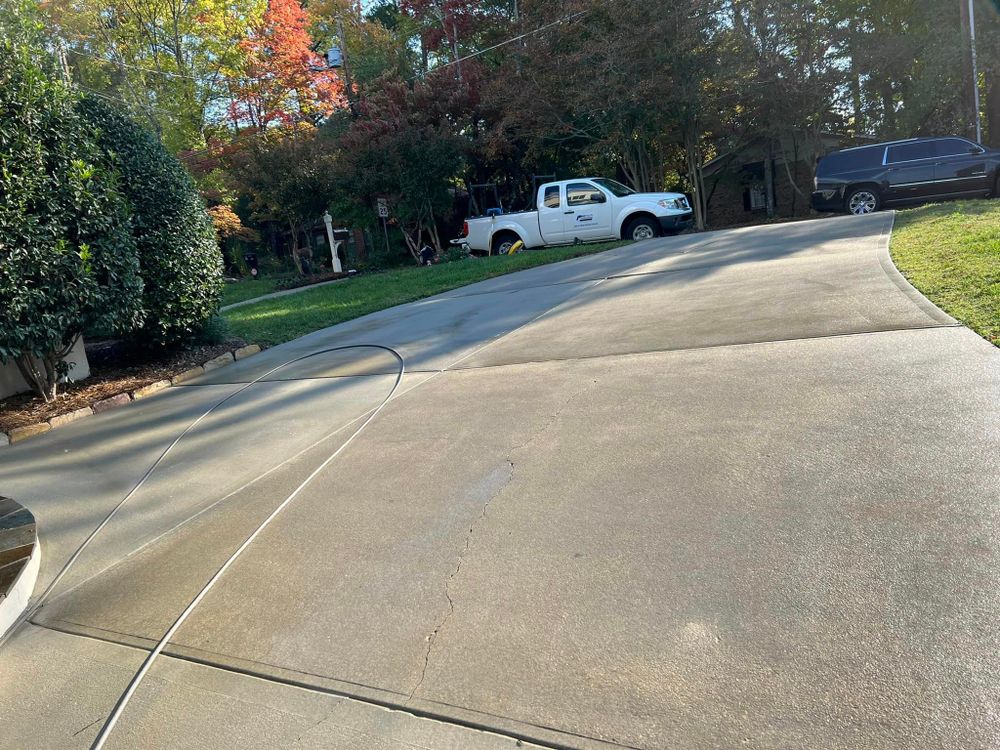 Our Driveway & Sidewalk Cleaning service is a great way to keep your home looking clean and inviting. We use high-pressure water to blast away dirt, grime, and leaves from your driveway and sidewalks. for Under Pressure: Pressure Washing Service in Raleigh, NC