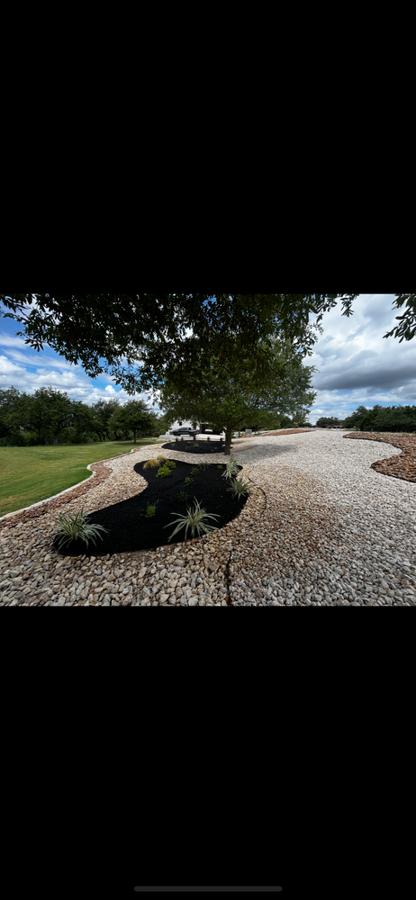 Transform your yard into a water-efficient haven with our Xeriscape service, combining natural stone hardscape elements and drought-resistant plants for a beautiful, sustainable landscape solution tailored to your home's unique needs. for Good and Green Landscaping in Canyon Lake, TX